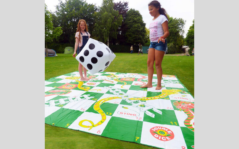 Win an outdoor Snakes and Ladders game What's On TV Magazine Competitions